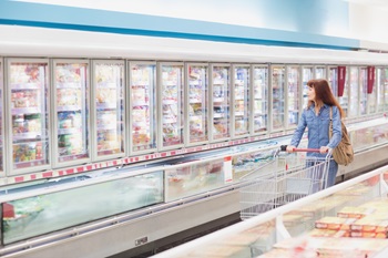Woman in frozen foods aisle