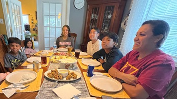 mg-caption:At the table with my family.