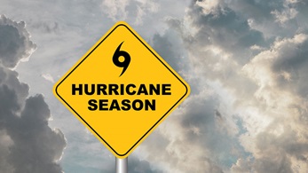 cloudy sky with road sign hurricane season