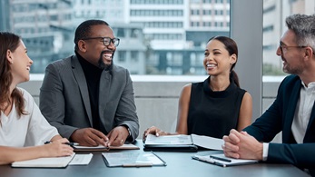 Business people working around a table.