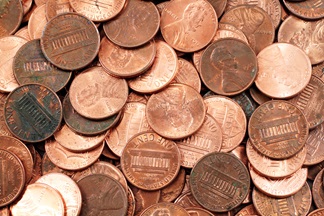 Roughly 50 loose pennies in a pile