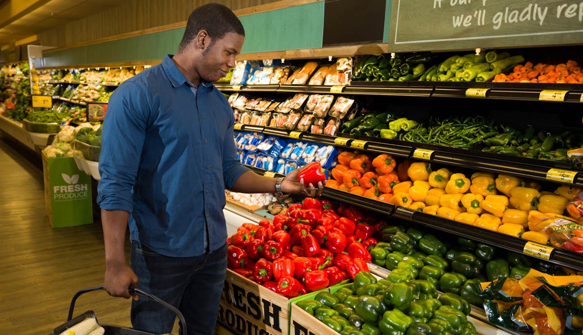 Man shopping in produce department