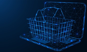 Blue digital outline of a grocery basket on top of a lap top computer with dark blue background.